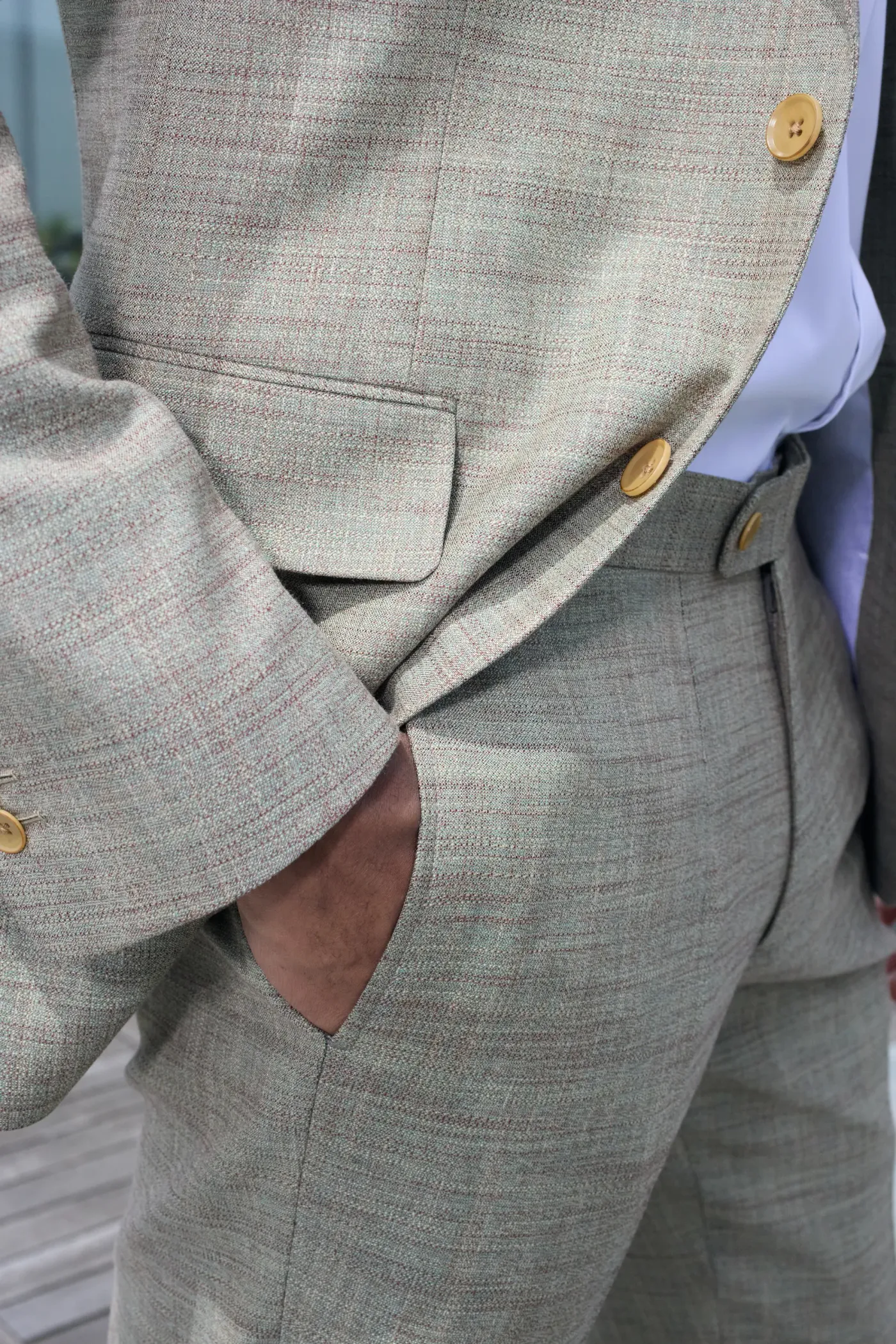 Detail — jacket pocket, working cuff buttons and the cloth