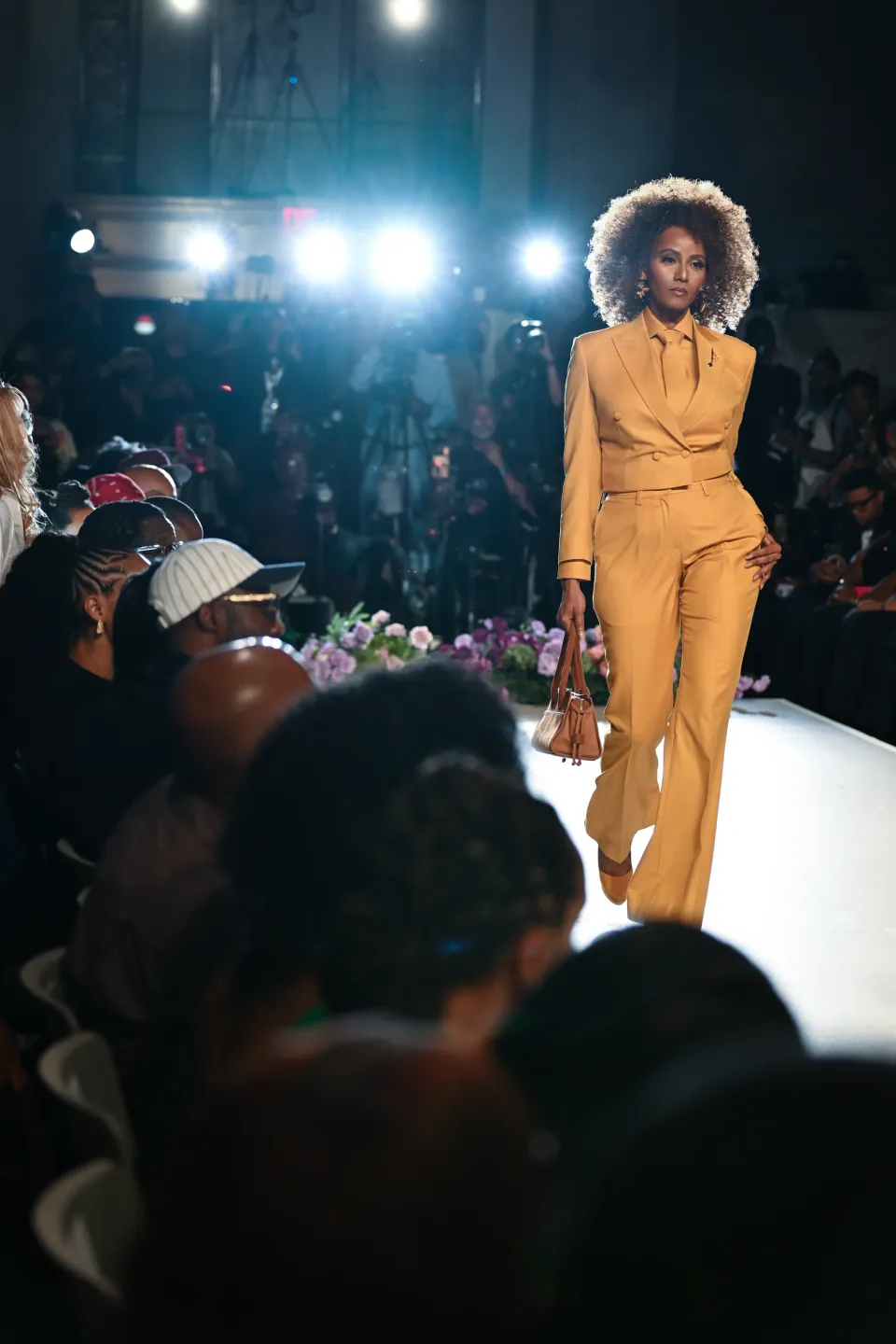 Ochre double-breasted trouser suit on the runway