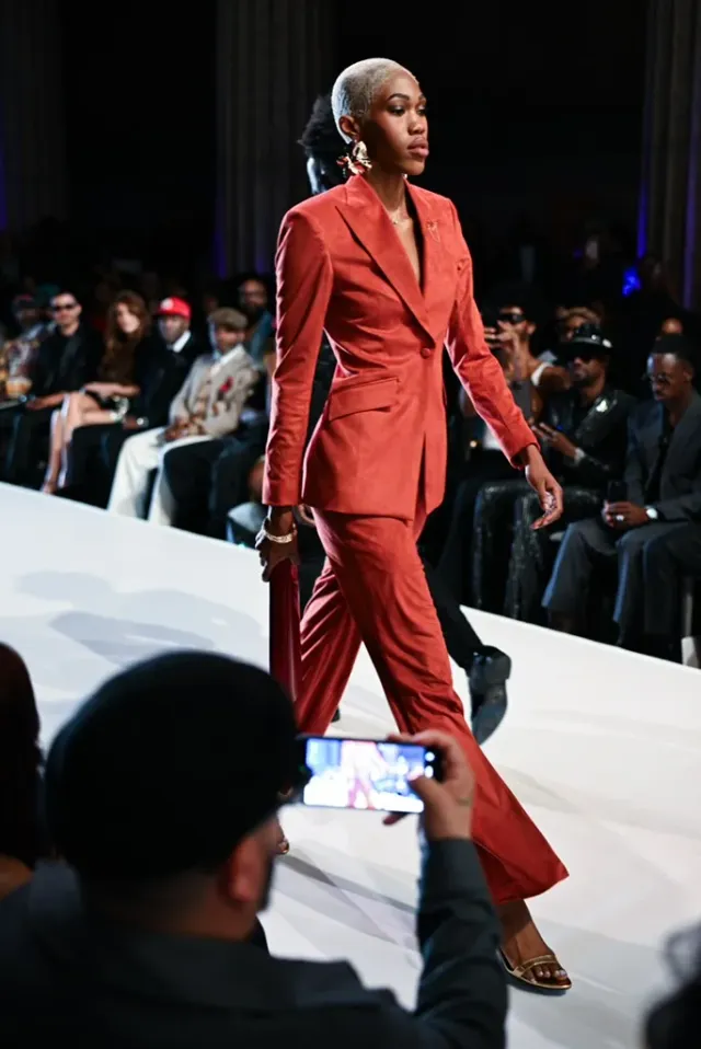 Rust single-breasted trouser suit on the runway